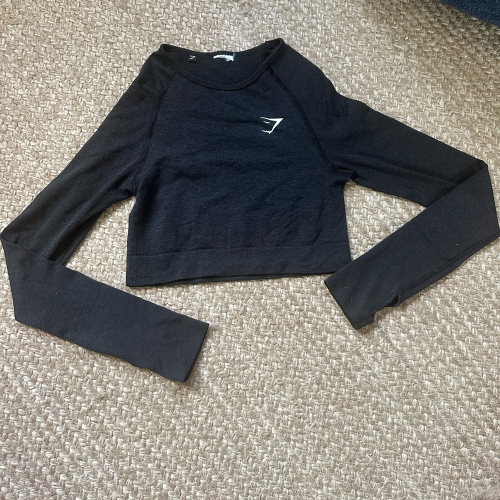 Gymshark long sleeve crop workout top. Dark grey size small lightly worn.